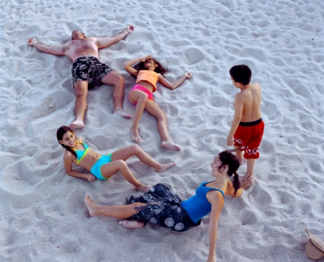 Miami Families - Family laying in sand
