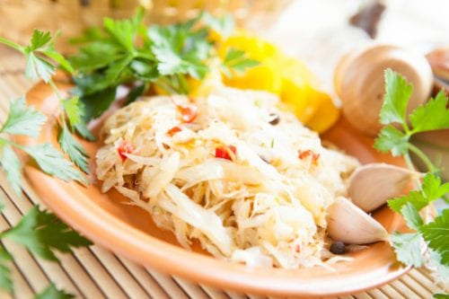 Cabbage and Tomato Salad with Yucca and Chicharrones