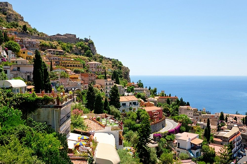 Sicilian town on a slope next to the coast. 