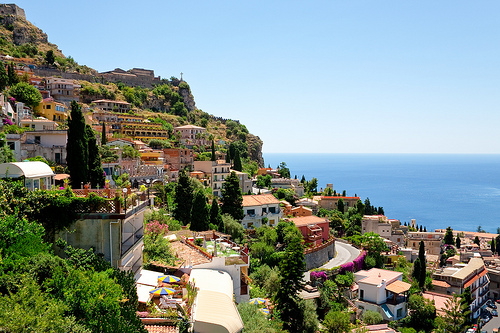 Sicilian town on a slope next to the coast. 