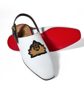 Men's babouche Louboutin slipper with Moroccan symbol.