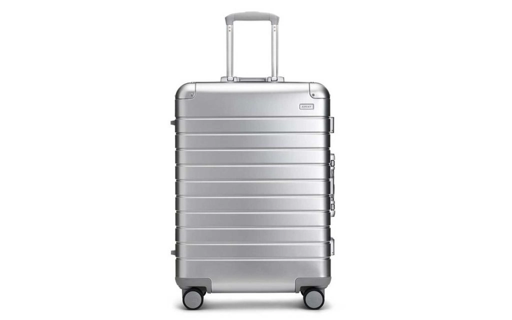 Silver aluminum suitcase from Away. 
