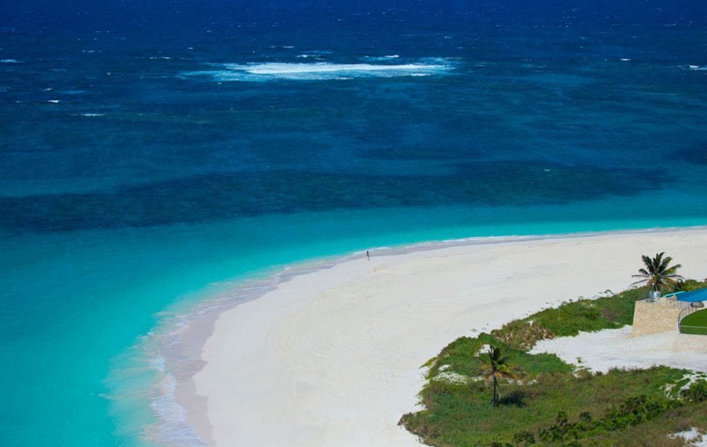 turquoise sea and white sand beach in baker's bay bahamas