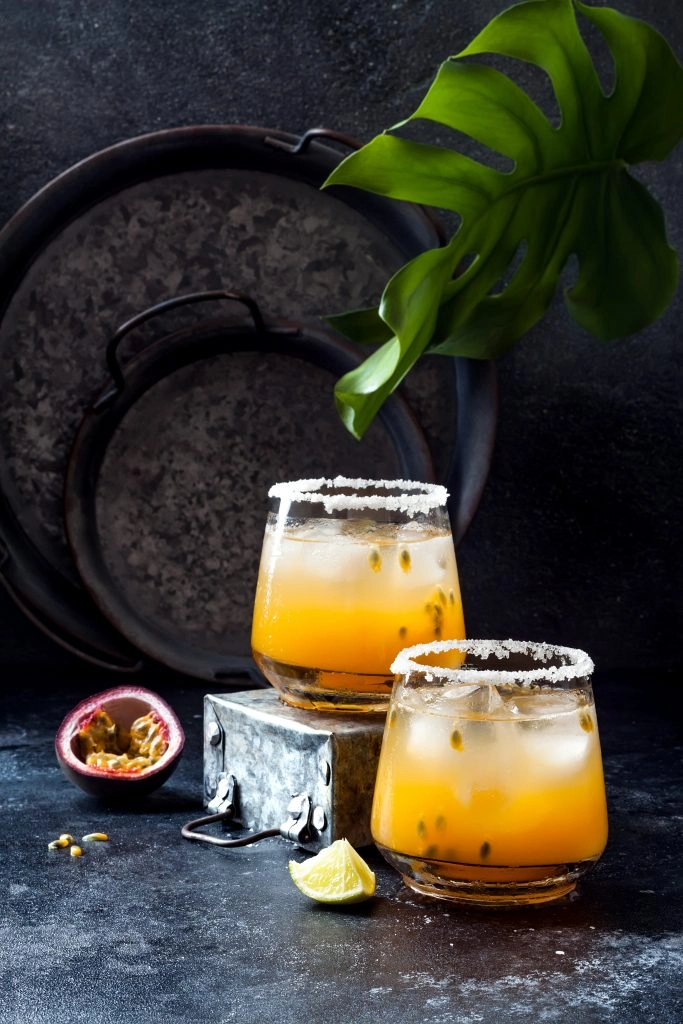 two glasses of passion fruit margaritas