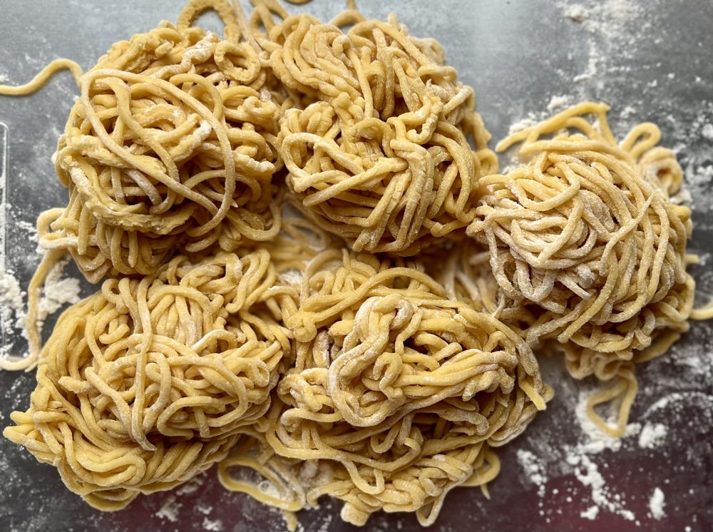 Bundles of spaghetti for cacio e Pepe