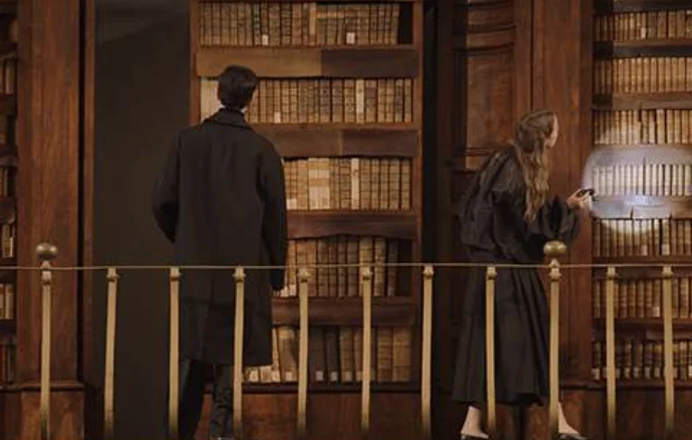 luxury library interior Bulgari Hotel Roma bookshelves warm lighting Rome Italy treasure hunt experience